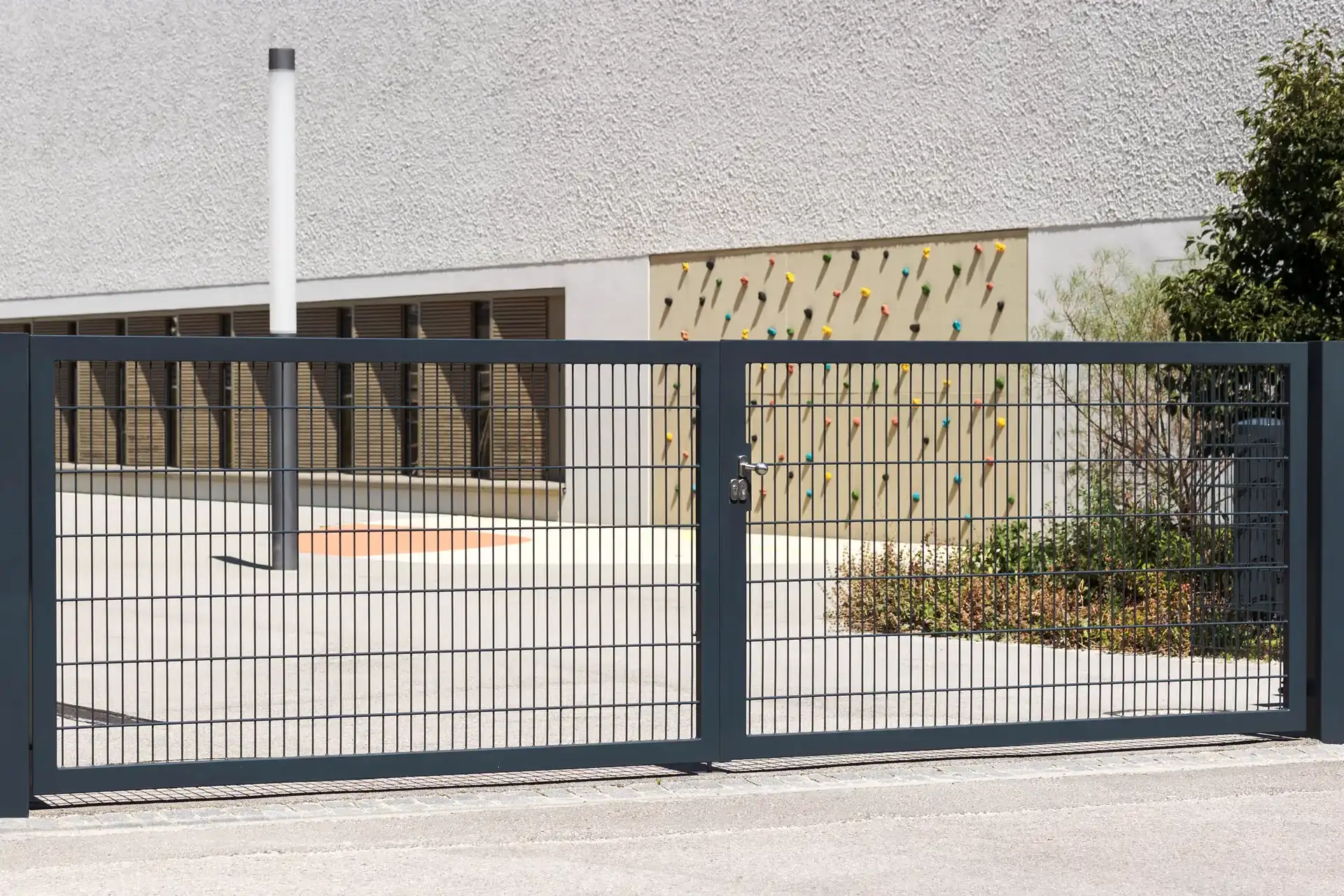 Grey mesh double gates at a commercial building, by Kingsley Build Group