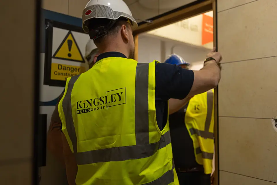 Kingsley operative at a secured doorway on a reactive maintenance call-out