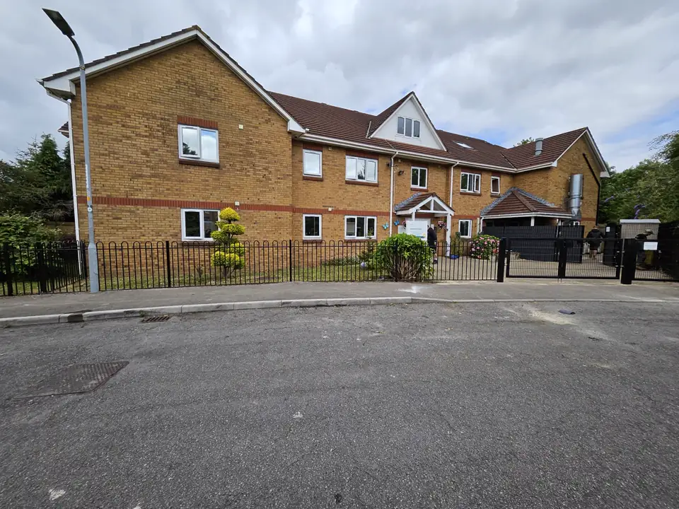 New black bow-top railings and gates outside a healthcare building in Newport