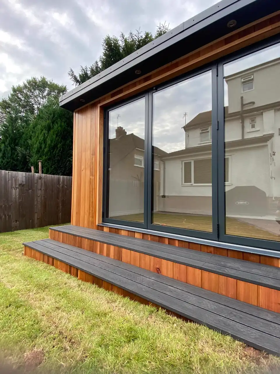 Garden room with bi-fold doors and composite steps