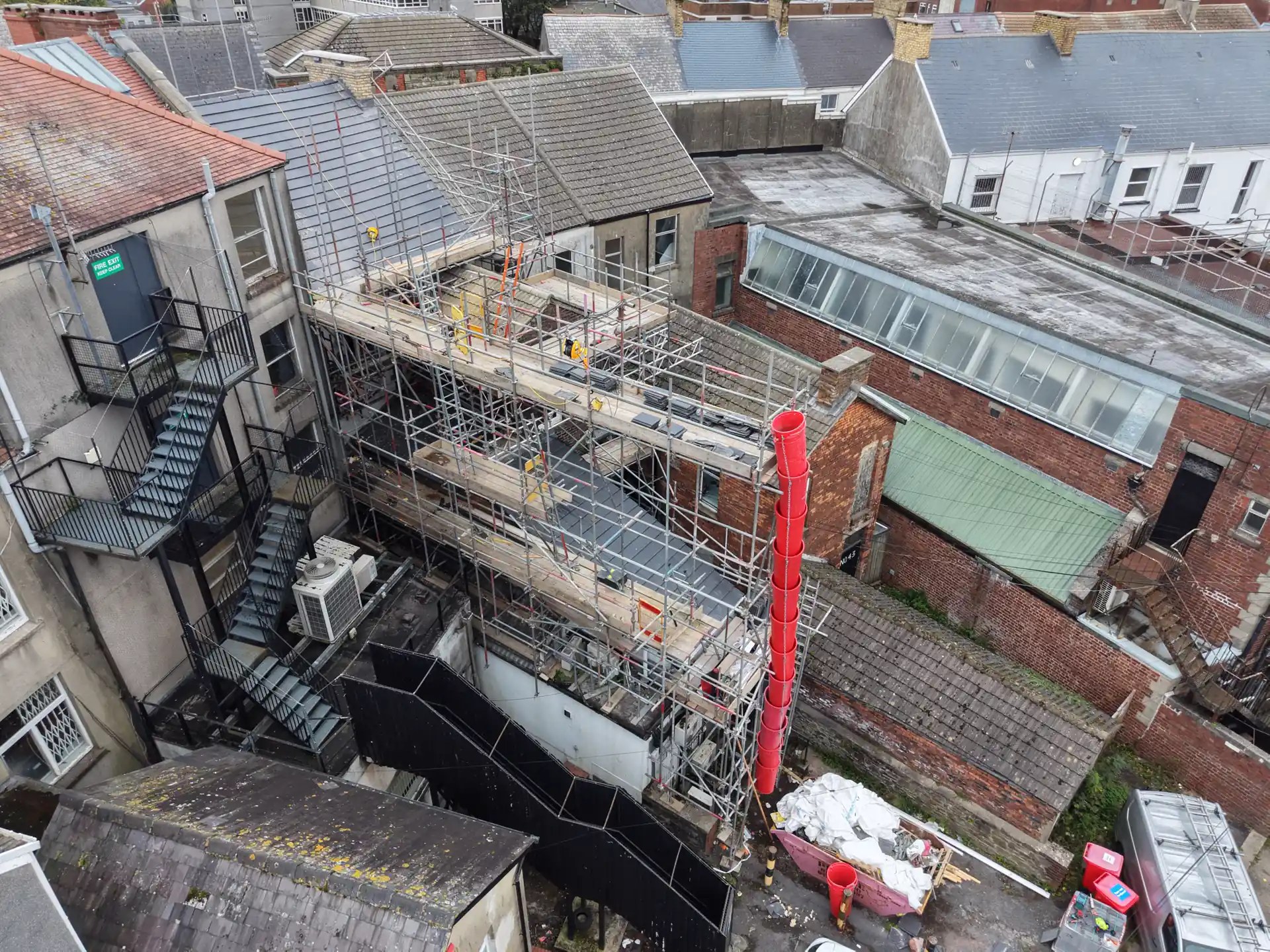 Roof scaffold and waste chute at a branch roof renewal in Llanelli, from above